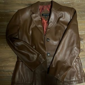 Valerie Steven’s lamb leather brown coat with black buttons